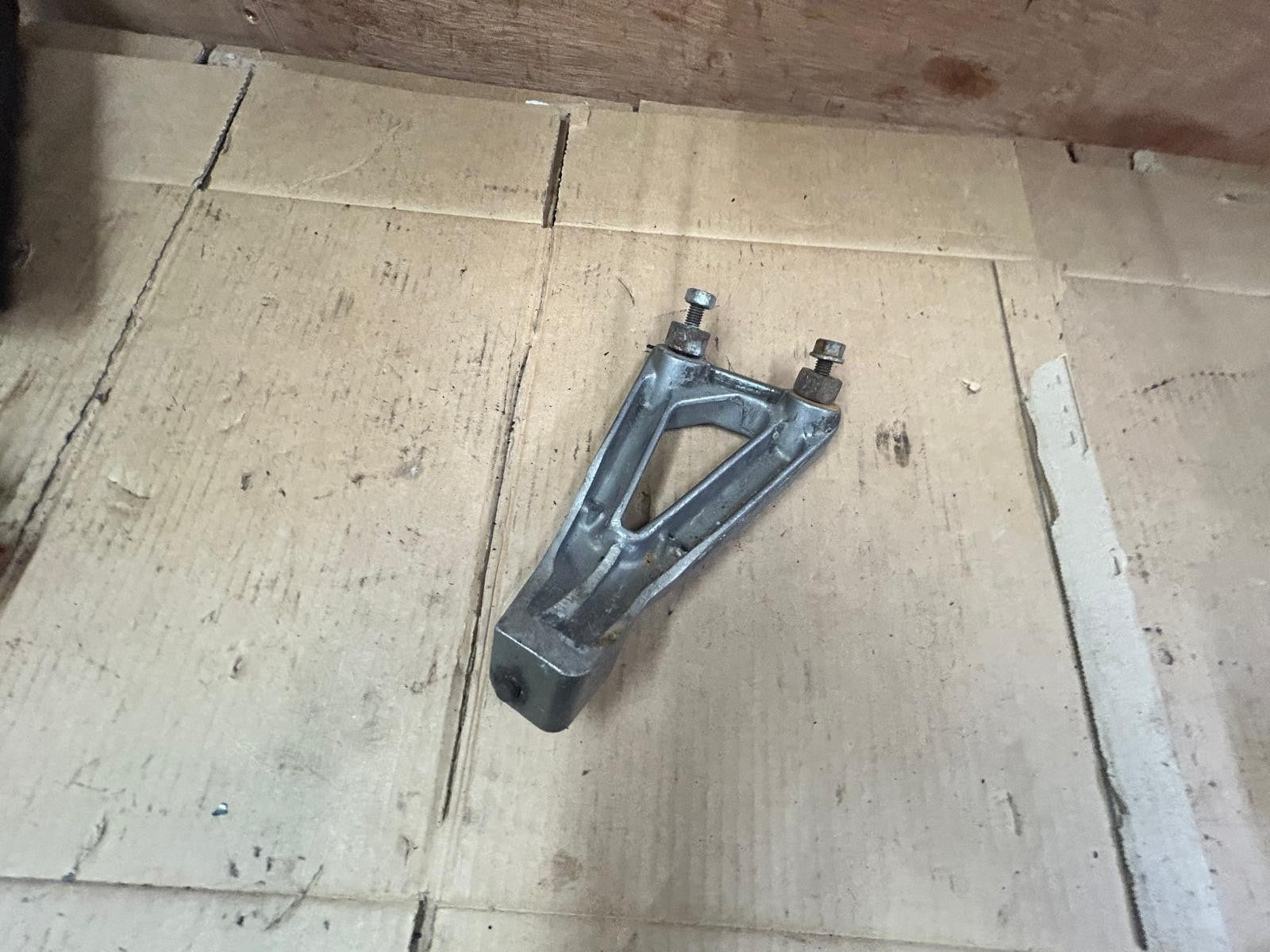 Suzuki GSF Bandit Left Passenger Footrest Bracket