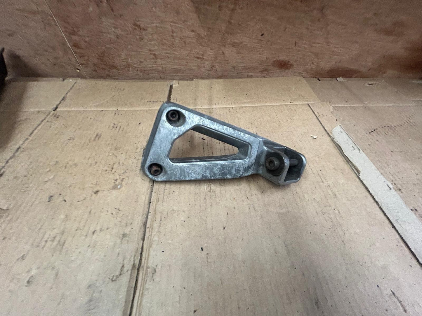 Suzuki GSF Bandit Left Passenger Footrest Bracket